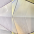 Close-up view of the dichroic glass fin with gold daylight reflections