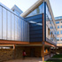 The timber construction creates a contrast in its context
