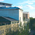 A colony of buildings packed into a triangular site