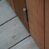 The continuity of the door paneling and the decking