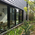 M7W28HI39X4QA9Q_03_Ribbon_window_in_vegetation_from_outside-MM