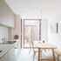 04_Common Ground Workshop_Architects_Llyod Eist House_Cottage Green_Building Narratives_Interior kitchen and dining_courtyard garden