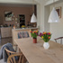 RRV9PK9631QT5CT_Zinc_Room_Photo_6_-_The_dinining_area__garden_room_with_the_kitchen_beyond