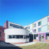 Courtyard with drum shaped meeting hall and facade to study bedrooms