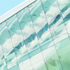 The glass frontage is sharply angled downwards to prevent reflections dazzling the players
