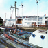 Building resembling boats it is sited next to in the harbour