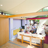 Folding doors allow the main meeting space to be divided into two smaller rooms. The mirror above the beam maintains the sense of continuous space 