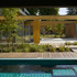 Internal swimming pool and external courtyard in summer