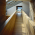 A view along the bridge and into the living room beyond