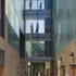 Glazed bridges connect the buildings. The Reglit helps to reflect the sunlight into the alley