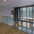 Looking towards the slate building’s entrance area from the reception space’s mezzanine floor