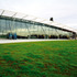 The south gable wall is shaded by a simple louvre awning