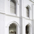 Exterior shot of the new visitor cafe showing lyme plaster finish which replaces pebble dash additions