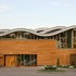 The external paved courtyard is overlooked by offices and a service block to the south