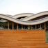 The undulating roof structure consists of four separate curved roof plates