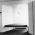 Seating built in to a side-lit recess in one of the corner rooms for fellows or graduates