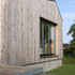 Larch board-on-board cladding and picture window