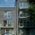 The building steps up one storey where the maisonettes meet the apartments