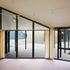 Looking out from an interior of a house along sheltered walkway