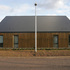Larch-clad facades feature recessed drainage and openings