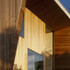 The timber-clad north facade responds to housing on the other side of the canal