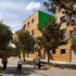 The housing mediates the scale of the terraced houses and Westfield