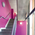 Public interior stairwells carry through the exterior colour scheme of each building