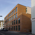 West elevation viewed from Phipp Street. Glazing frames to offices are flush with the brickwork