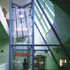 The brightly coloured lift assembly and the sunburst ceiling lighting contribute to the informal
