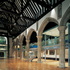 The new timber flooring sweeps through to the platform in the north aisle, in the background above lies the new steel structural platform with glass balustrades
