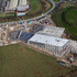 Aerial view of the construction site revealing the building’s steel frame