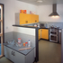 Childrens kitchen in the foreground with the full kitchen beyond
