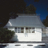 Re-roofed summer house with circular-section connecting passage