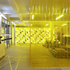 A heavy duty bright yellow PVC sheet divides the shop floor 