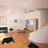 The living area with stairs to an internal balcony