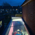 A glass ceiling allows light into the extended kitchen
